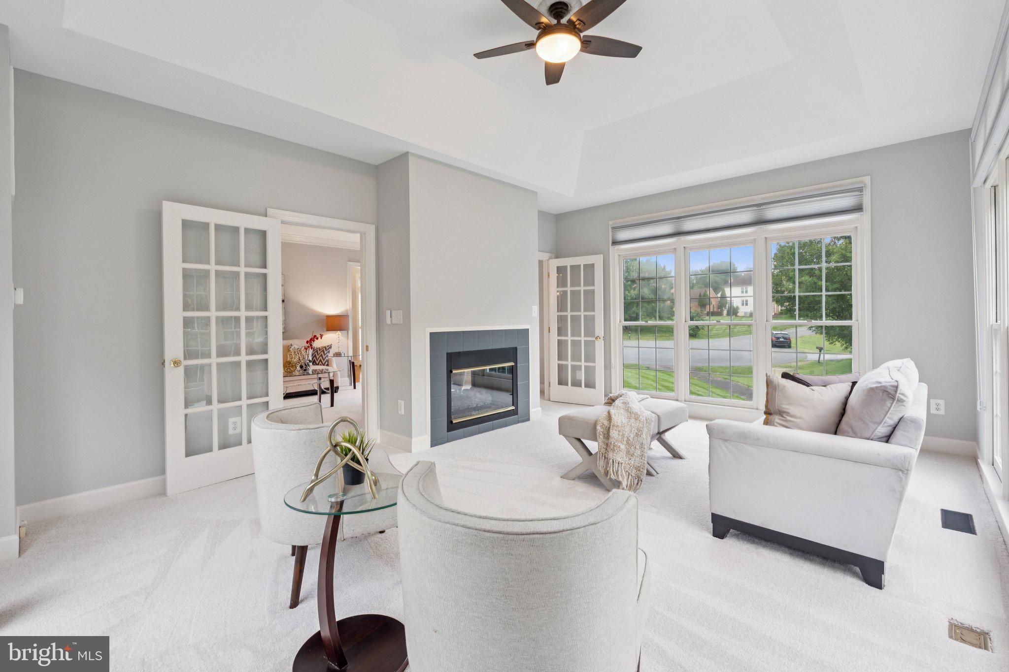 12213 Windsor Hall Way Herndon, VA 20170 - Photo 11 of 64 a living room with furniture and a large window