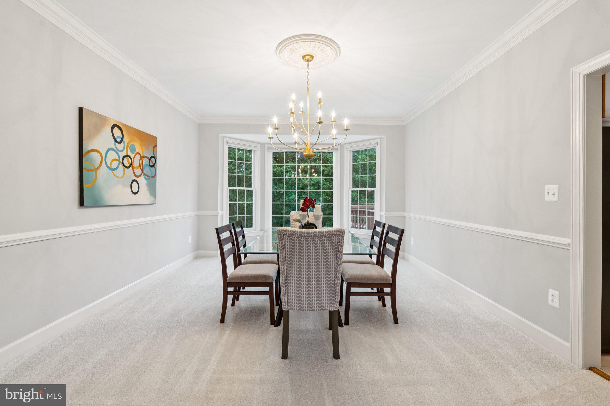 12213 Windsor Hall Way Herndon, VA 20170 - Photo 14 of 64 a view of a dining room with furniture large window and outside view