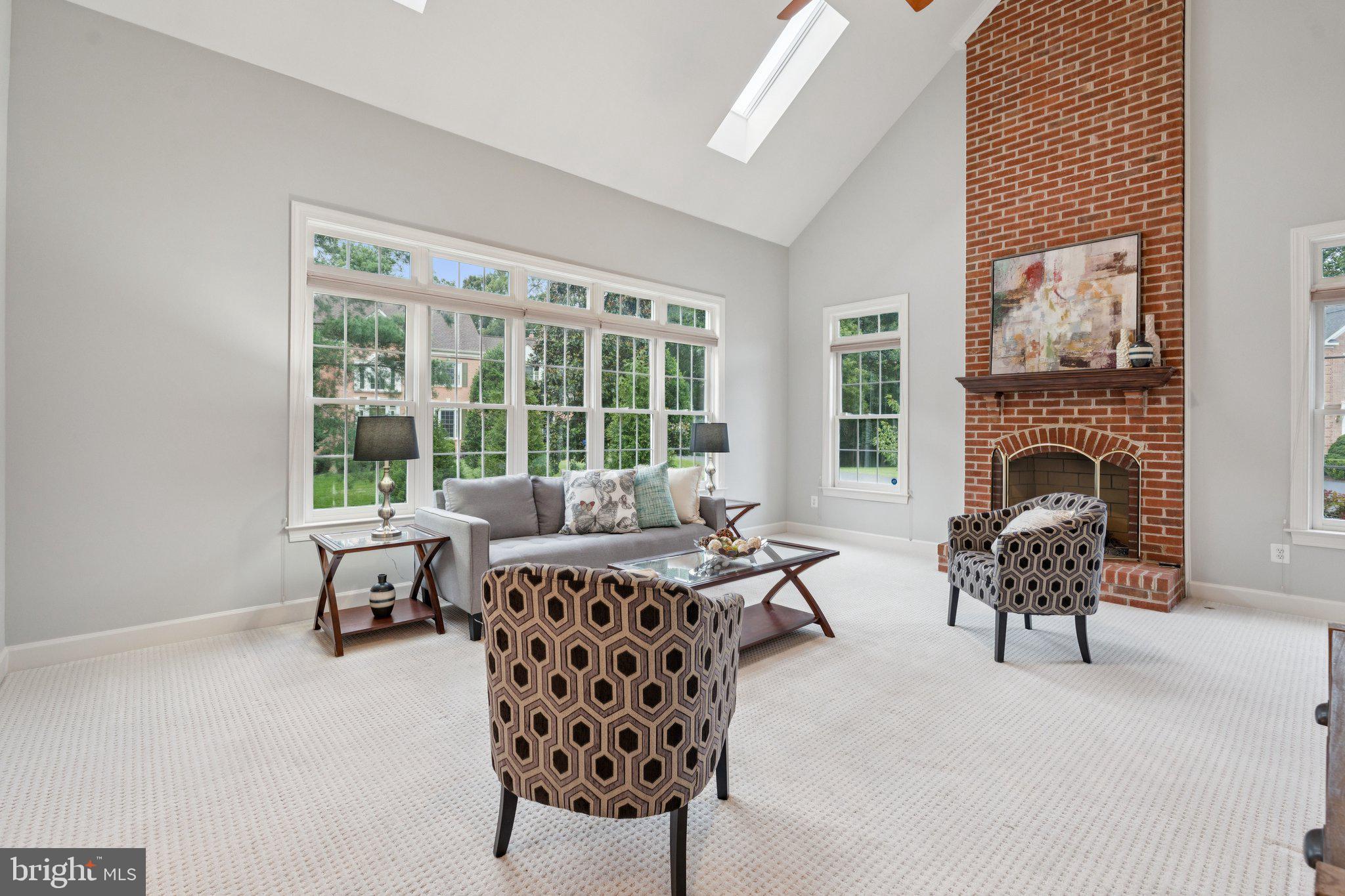 12213 Windsor Hall Way Herndon, VA 20170 - Photo 23 of 64 a living room with furniture and a fireplace