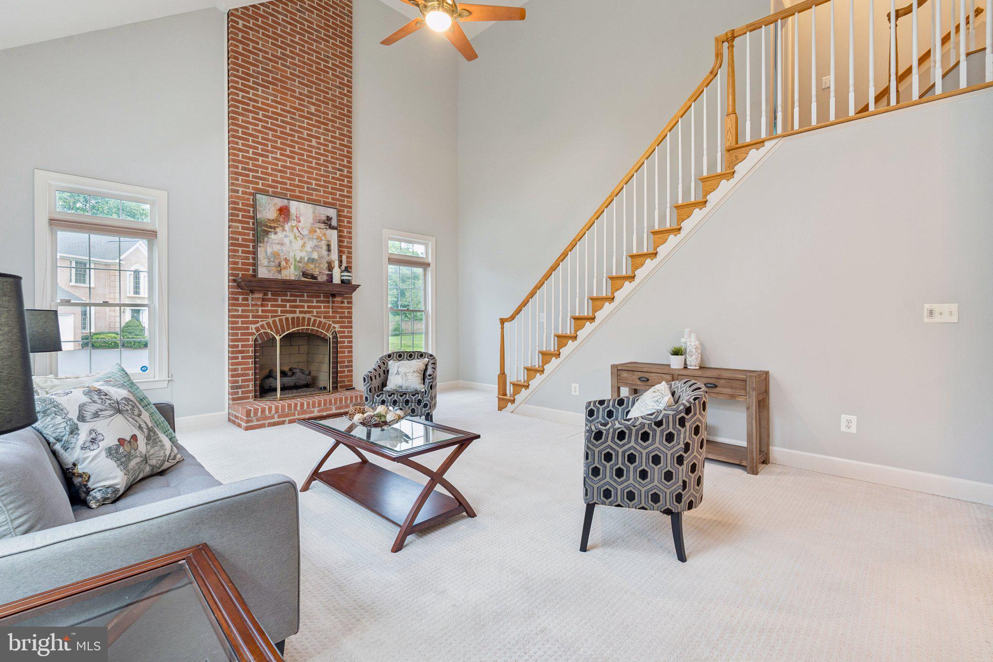 12213 Windsor Hall Way Herndon, VA 20170 - Photo 24 of 64 a living room with furniture and a fireplace