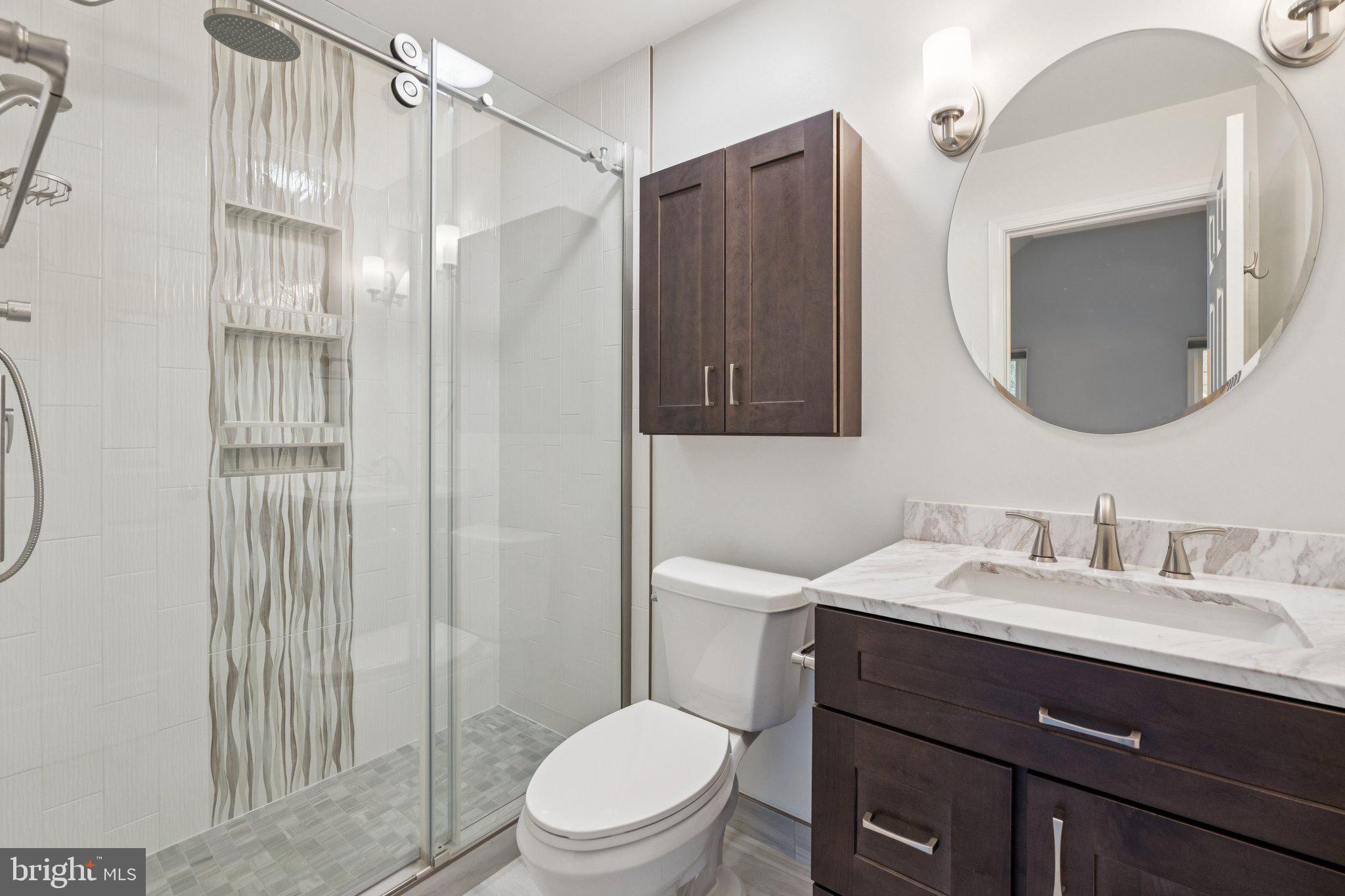 12213 Windsor Hall Way Herndon, VA 20170 - Photo 36 of 64 a bathroom with a sink vanity mirror and toilet
