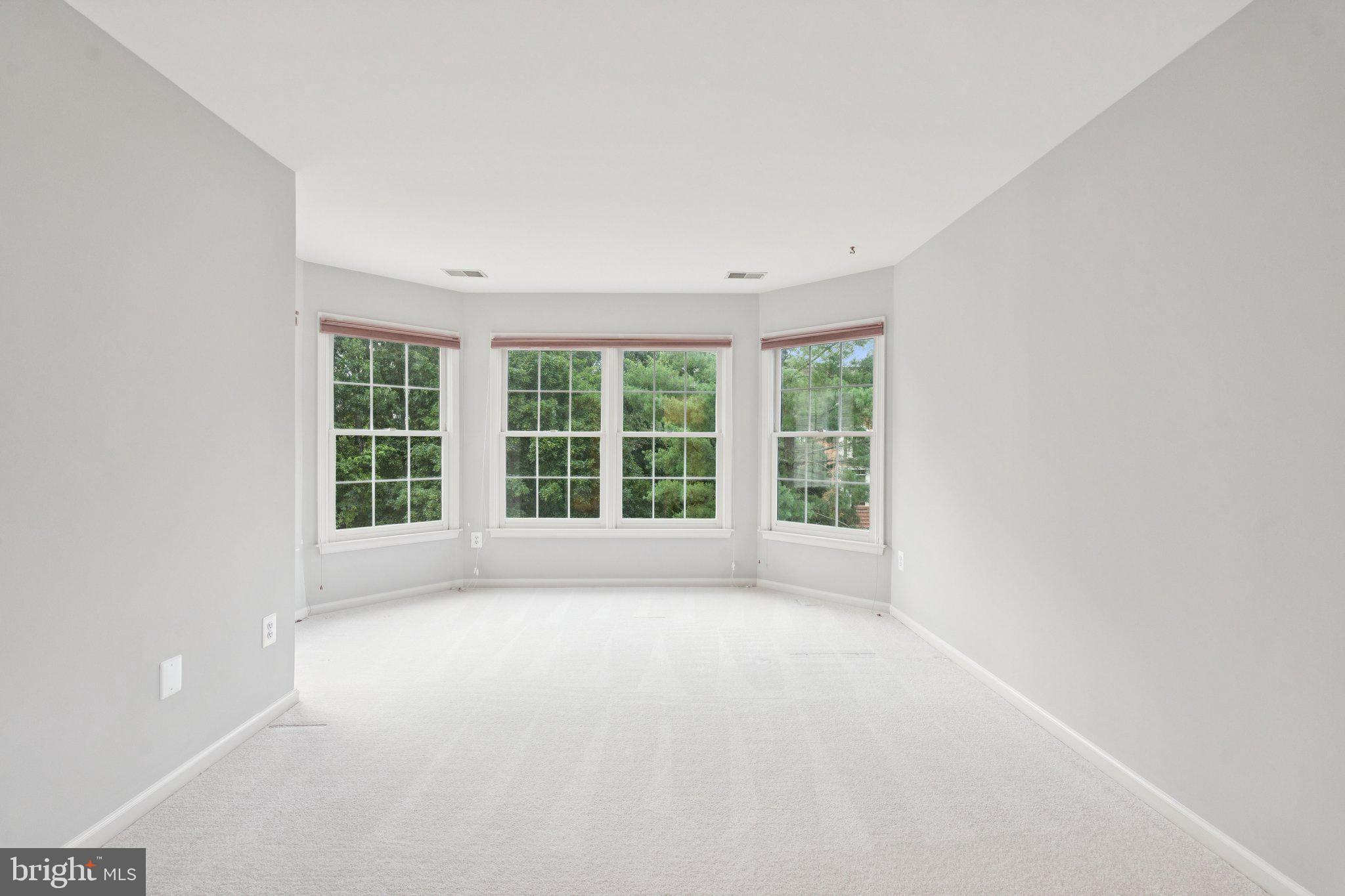 12213 Windsor Hall Way Herndon, VA 20170 - Photo 37 of 64 a view of an empty room with a window