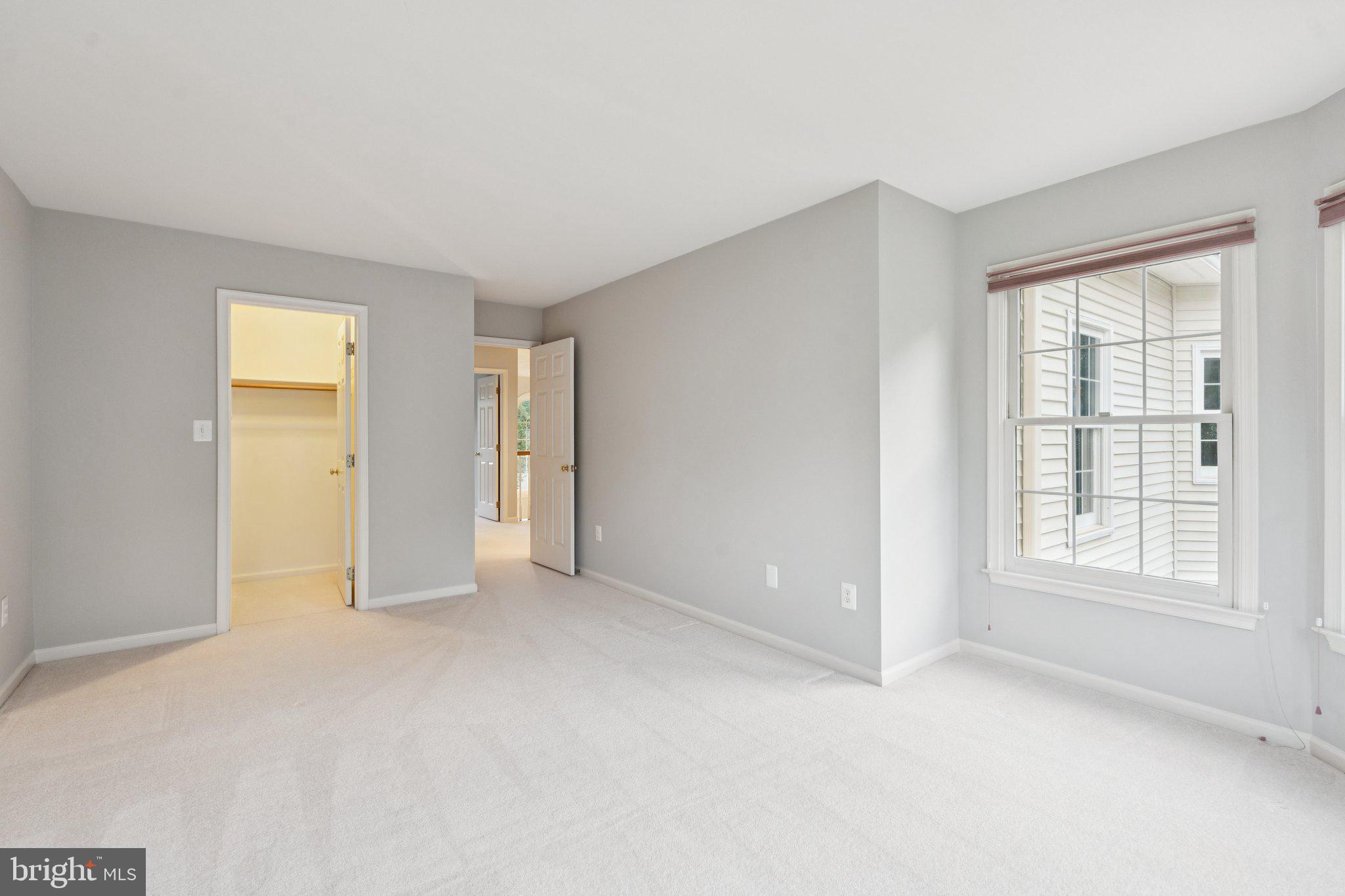 12213 Windsor Hall Way Herndon, VA 20170 - Photo 39 of 64 an empty room with windows and closet