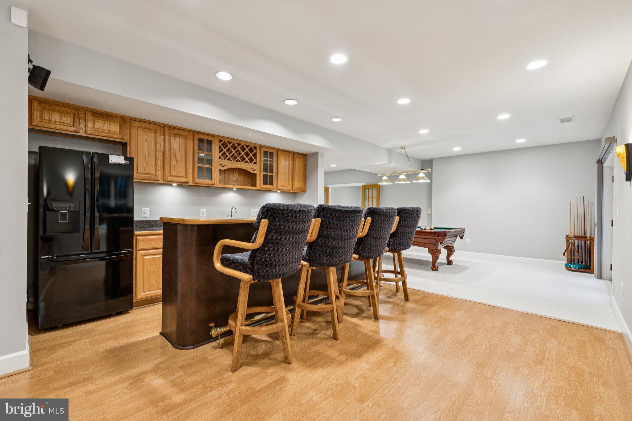 12213 Windsor Hall Way Herndon, VA 20170 - Photo 50 of 64 a view of a dining room with furniture