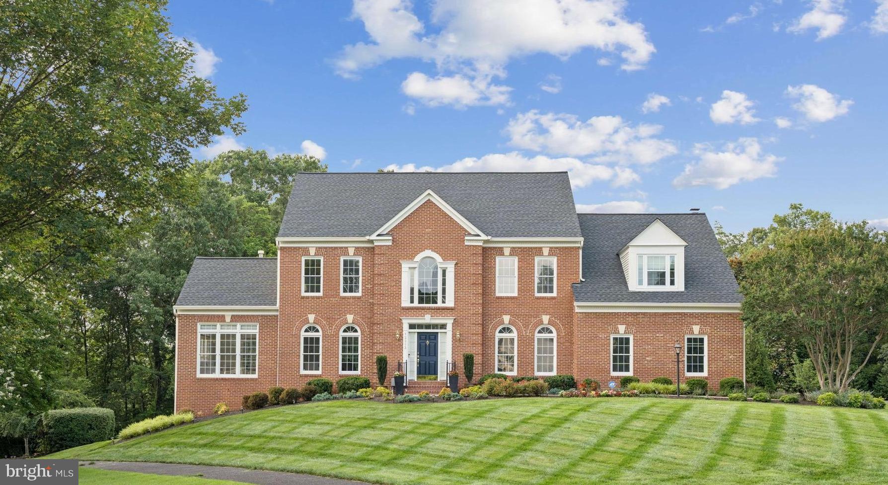 12213 Windsor Hall Way Herndon, VA 20170 - Photo 5 of 64 front view of a house with a yard
