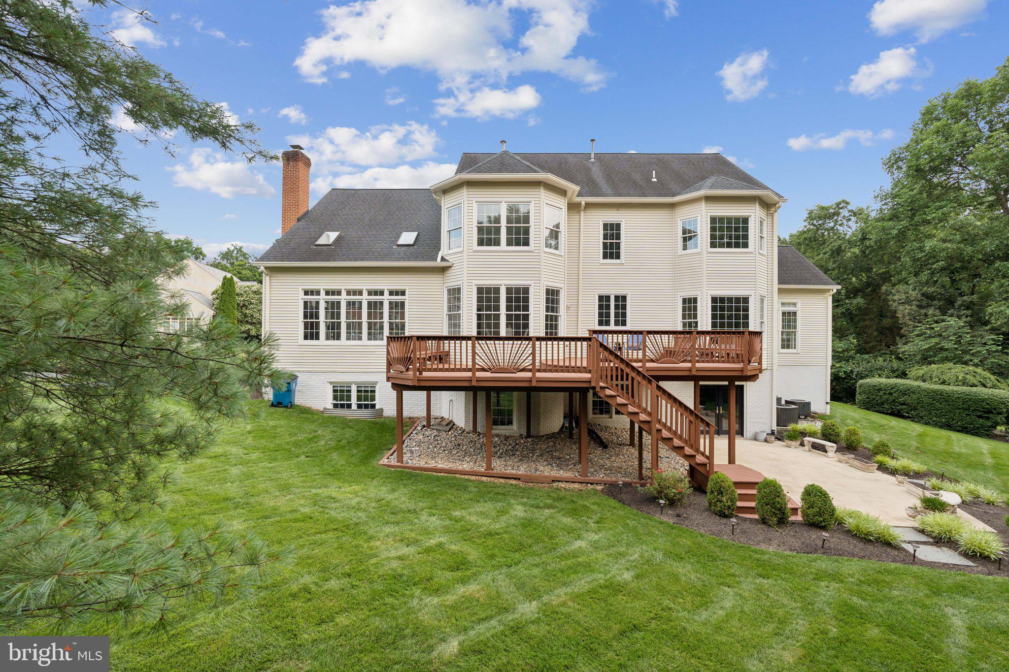 12213 Windsor Hall Way Herndon, VA 20170 - Photo 60 of 64 a view of a house with a swimming pool and sitting area