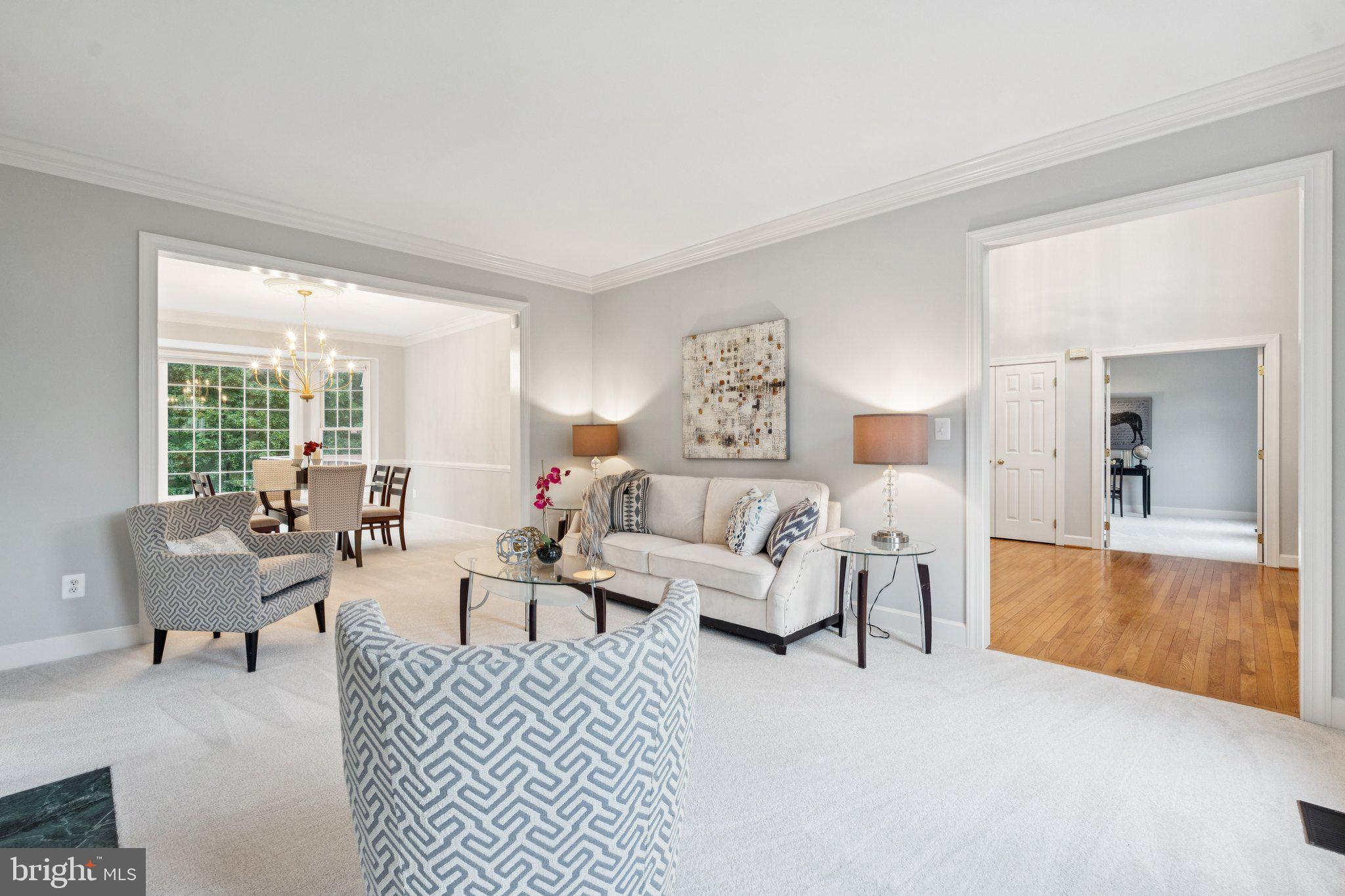 12213 Windsor Hall Way Herndon, VA 20170 - Photo 8 of 64 a living room with furniture and a large window