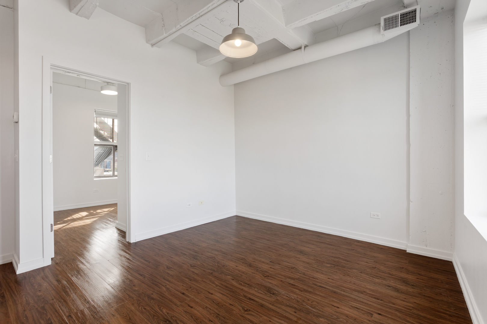 1325 West Wilson Avenue, Unit 1011 Chicago, IL 60640 - Photo 5 of 22 wooden floor in an empty room