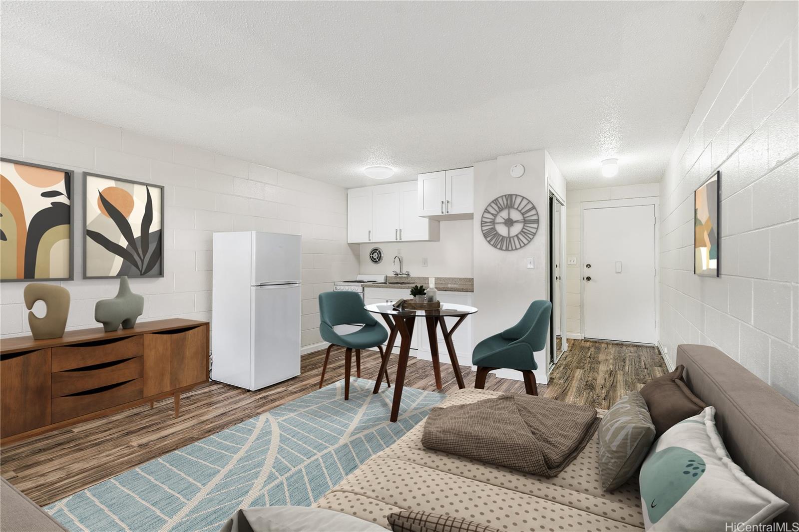 a living room with furniture and wooden floor