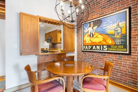 a kitchen with stainless steel appliances a sink stove top oven and cabinets