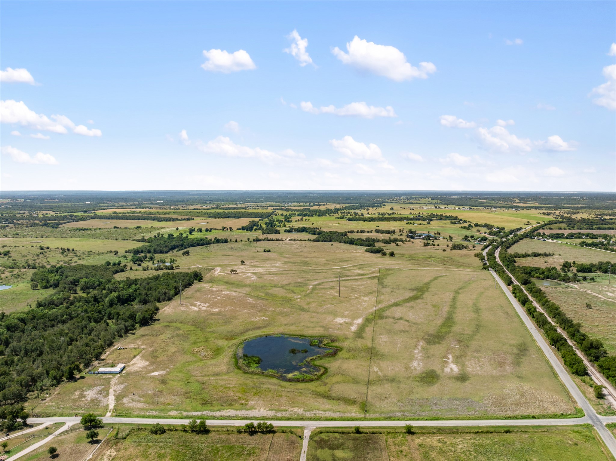 -littig Rd Littig Road Elgin, TX 78621 - Photo 5 of 37 Overview of rural landscape featuring a nearby body of water