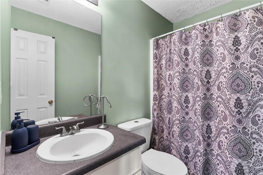 3234 Mineral Ridge Lane Stone Mountain, GA 30087 - Photo 39 of 55 a bathroom with a sink and a mirror