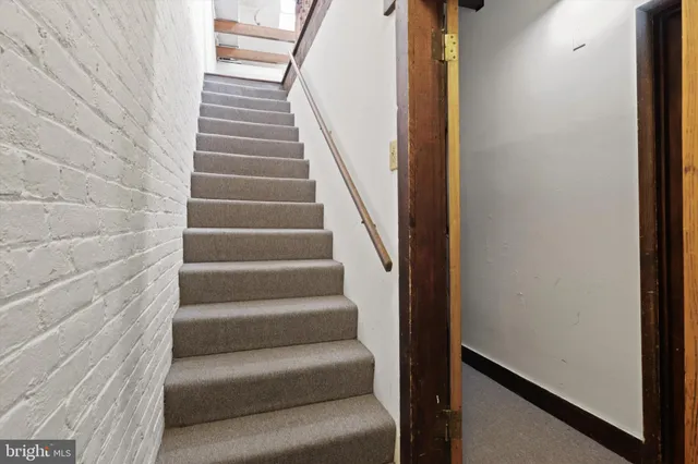 a view of a living room with wooden floor