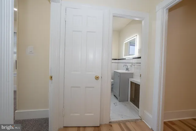 a view of a hallway with washer and dryer