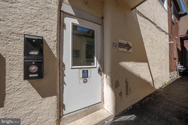 a sign on the wall of the building