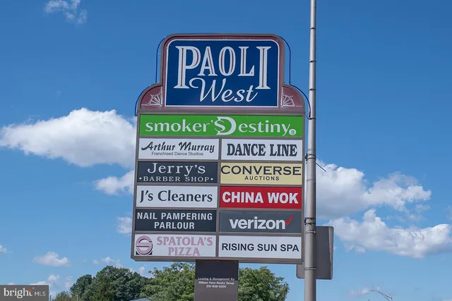 a view of a street with a building in the background