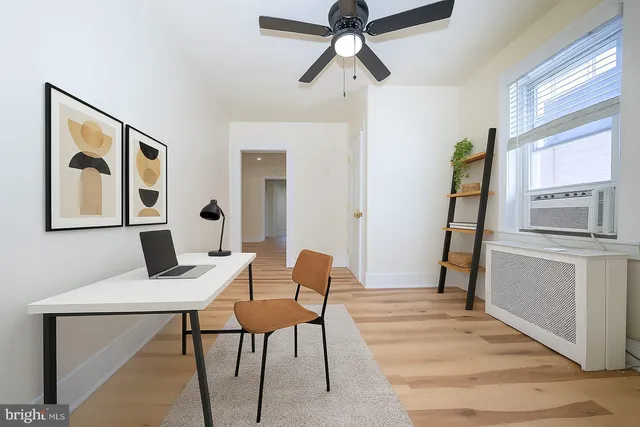 a workspace with furniture and window