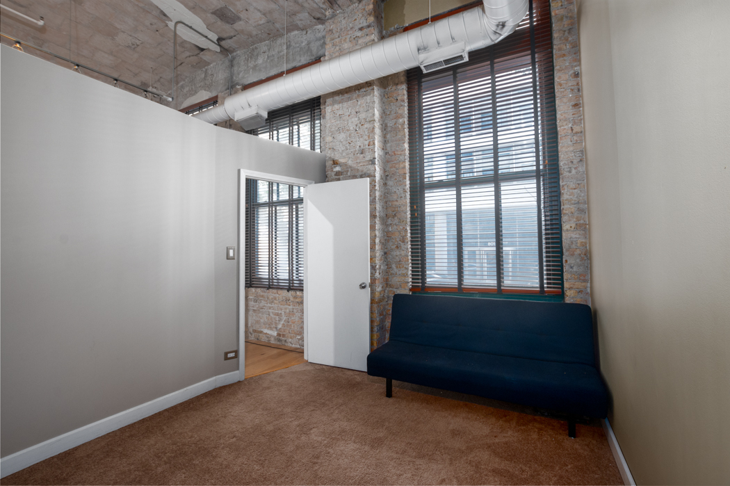 801 South Wells Street, Unit 102 Chicago, IL 60607 - Photo 20 of 26 a view of bedroom with furniture and entryway