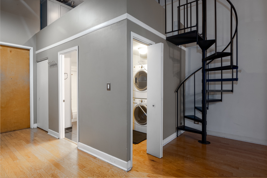 801 South Wells Street, Unit 102 Chicago, IL 60607 - Photo 22 of 26 a view of an entryway with wooden floor and staircase