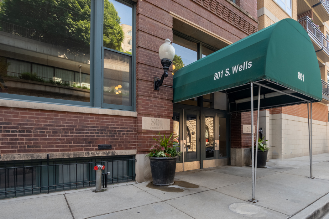 801 South Wells Street, Unit 102 Chicago, IL 60607 - Photo 4 of 26 a front view of a building with retail shop