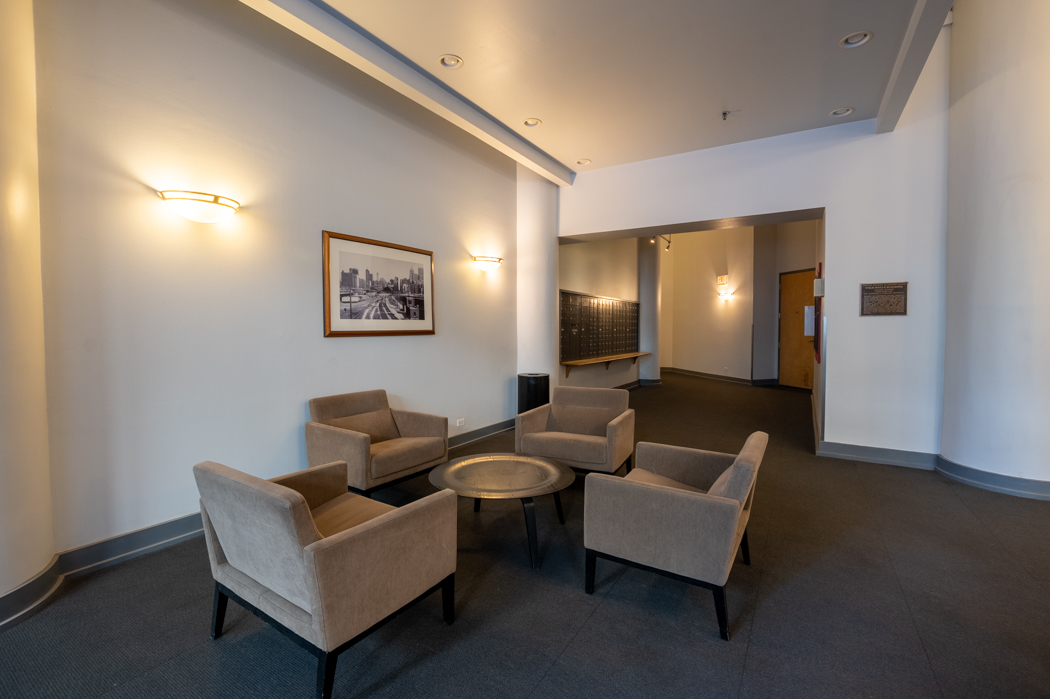 801 South Wells Street, Unit 102 Chicago, IL 60607 - Photo 7 of 26 a living room with furniture and a potted plant