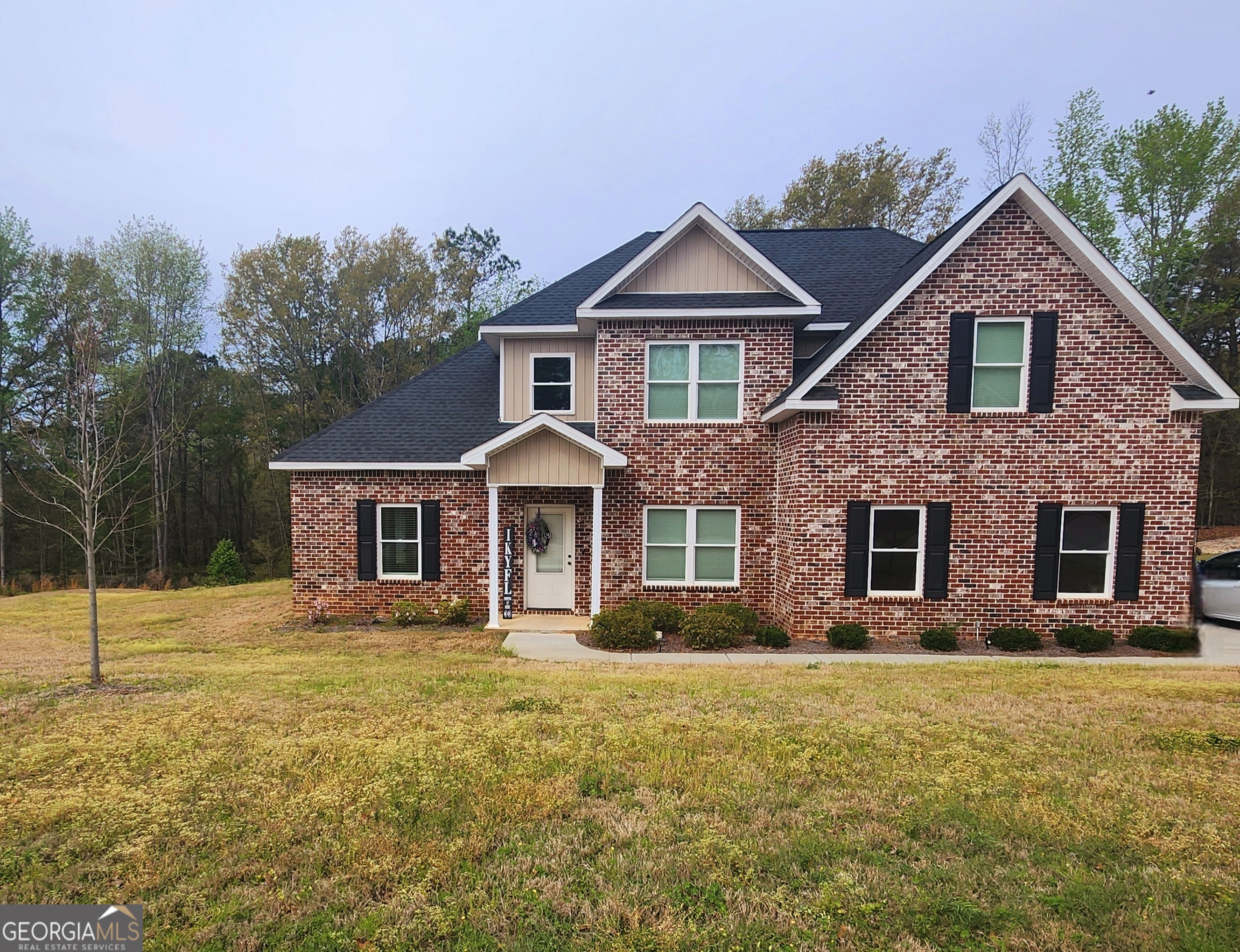 a front view of a house with a yard