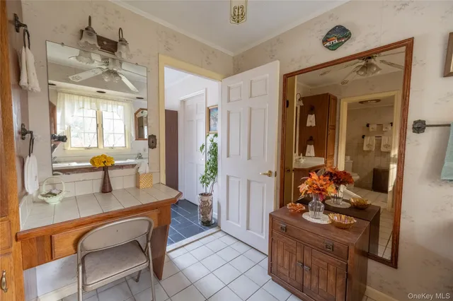 a room with furniture a chandelier and a dining table
