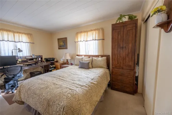 a bed room with bed and window
