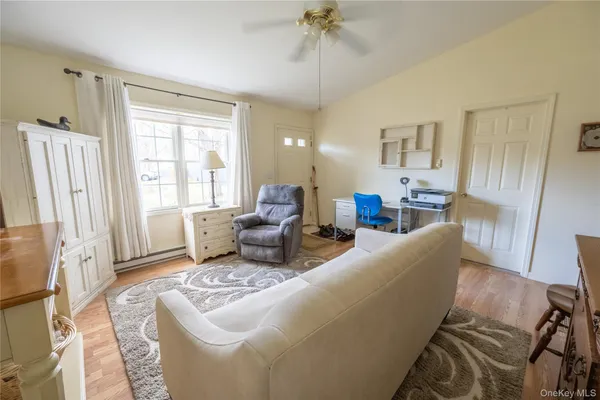 a living room with furniture and a window