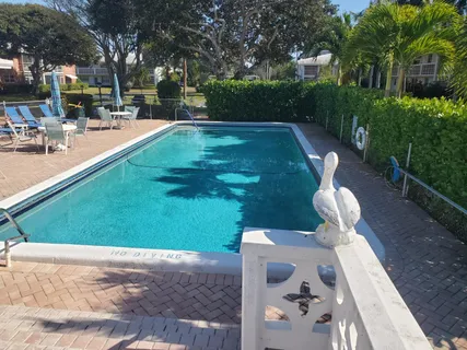 a view of backyard with sitting area