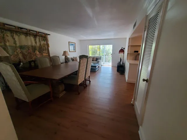 a view of a livingroom with furniture window and wooden floor