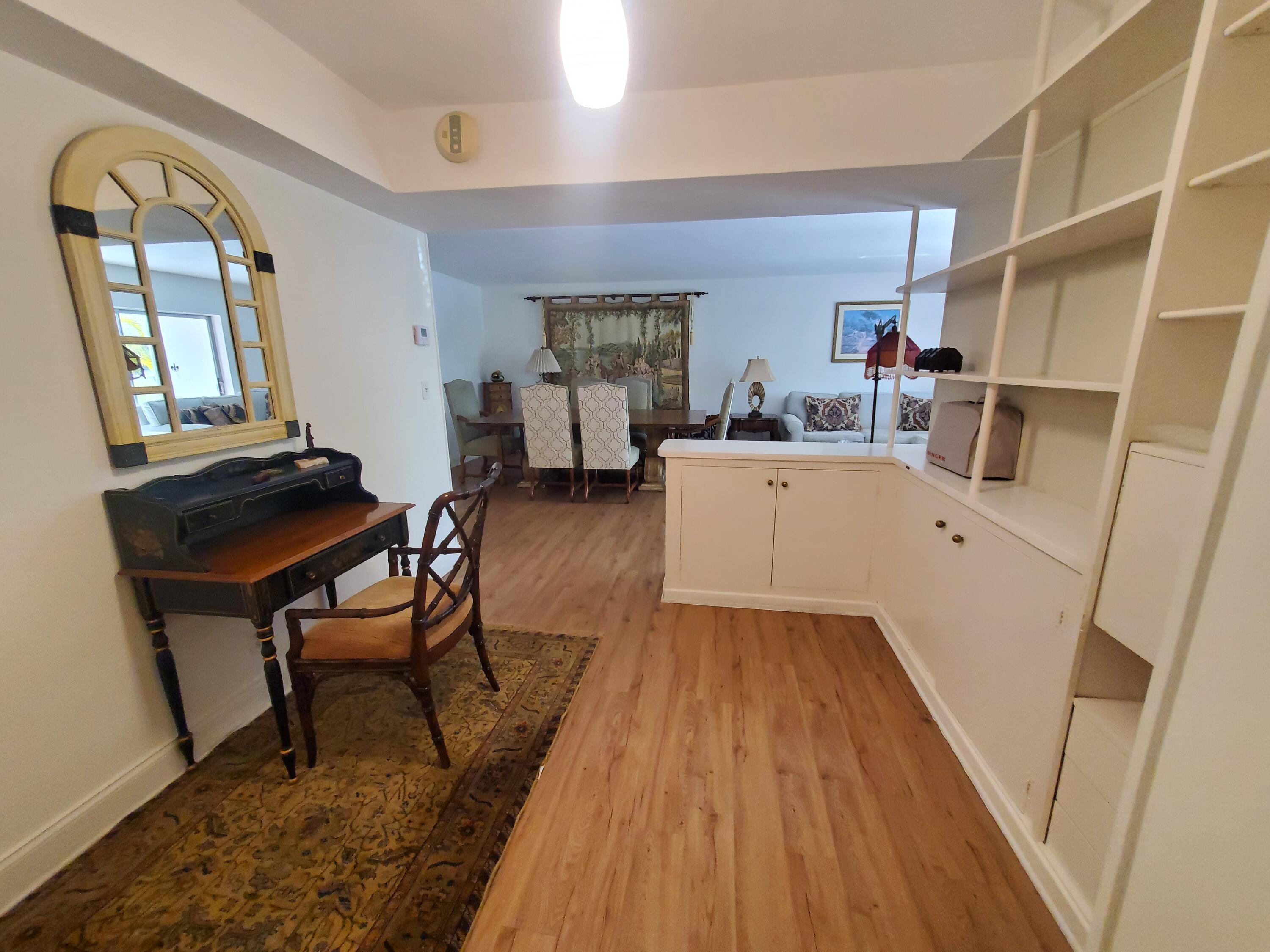 20 Southeast 13th Street, Unit A6 Boca Raton, FL 33432 - Photo 5 of 14 a living room with furniture and a wooden floor
