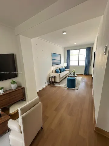 a kitchen with a stove and a refrigerator