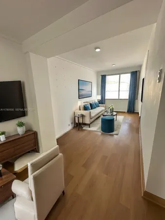 a kitchen with a stove and a refrigerator