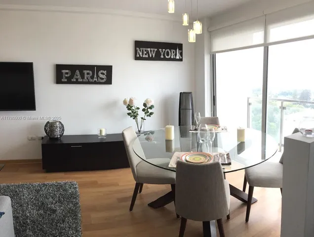 a bedroom with a large bed and a large window