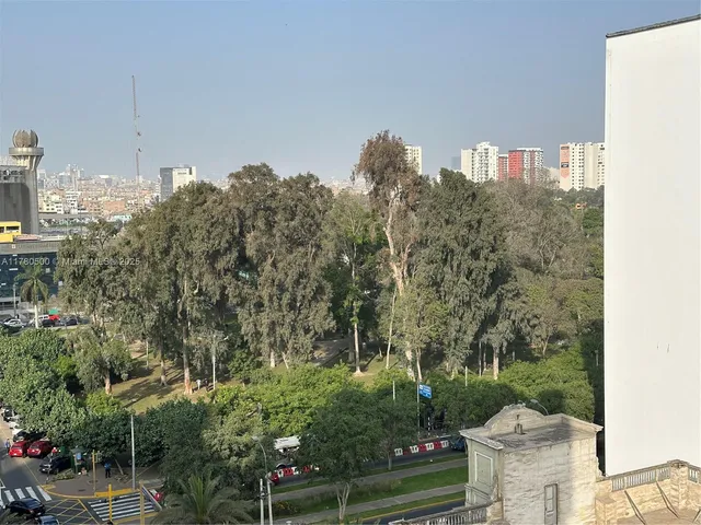 an empty room with large windows