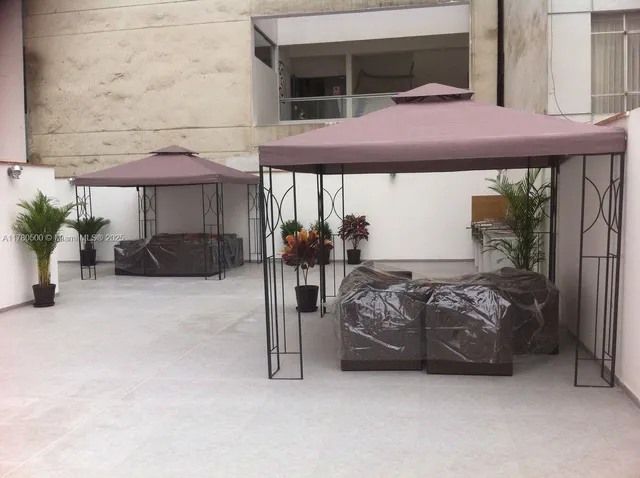 a workspace with furniture and a potted plant