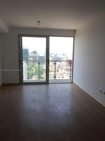 a view of a floor to ceiling window and furniture