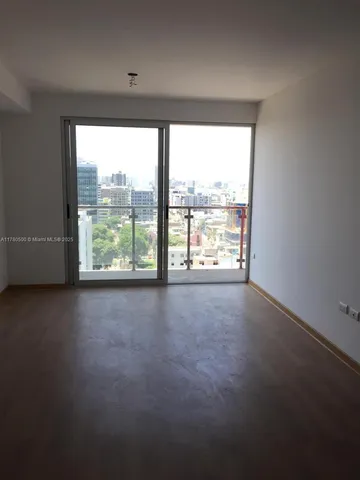 a view of a floor to ceiling window and furniture