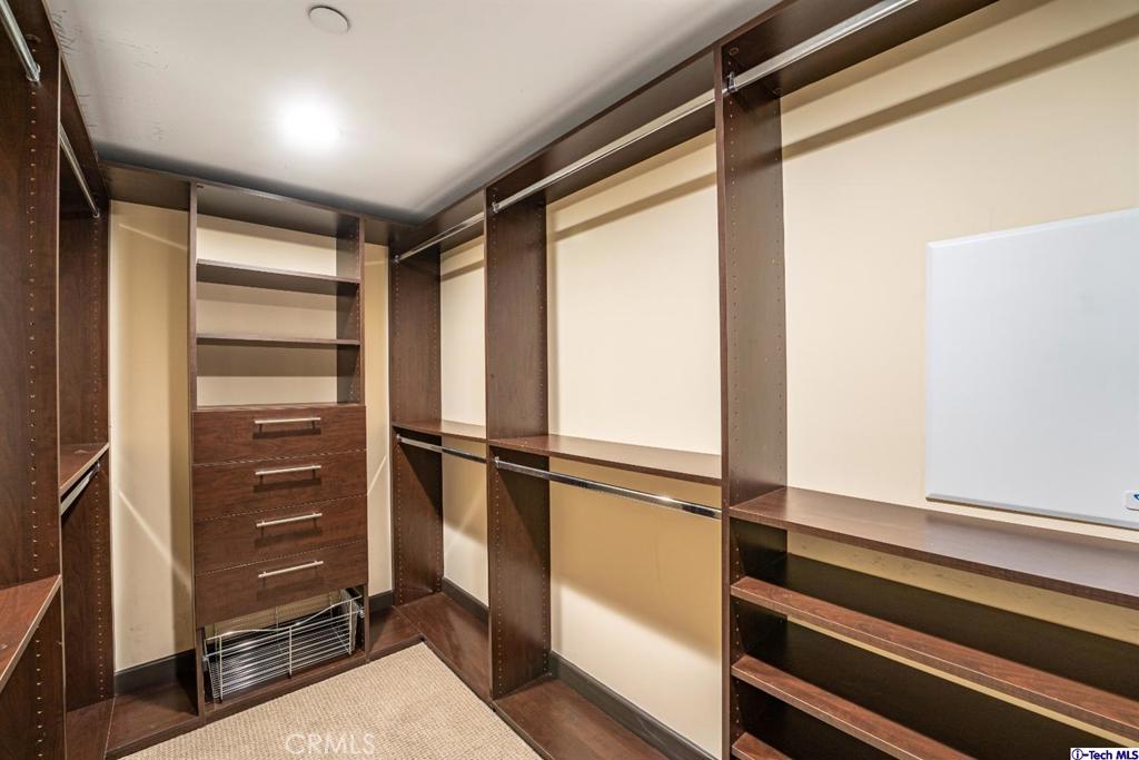 10523 Ashton Avenue, Unit 202 Los Angeles, CA 90024 - Photo 22 of 36 a view of walk in closet with empty racks