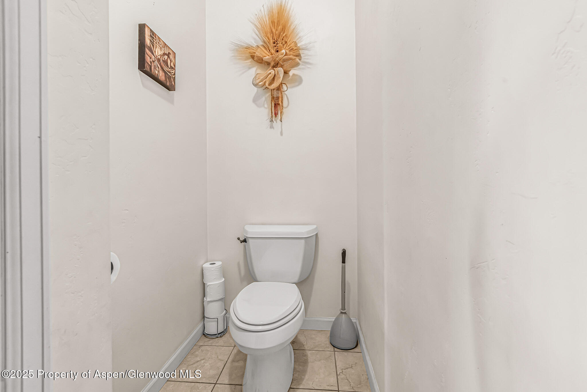1357 West Spruce Court Rifle, CO 81650 - Photo 13 of 38 a bathroom with a toilet and a sink