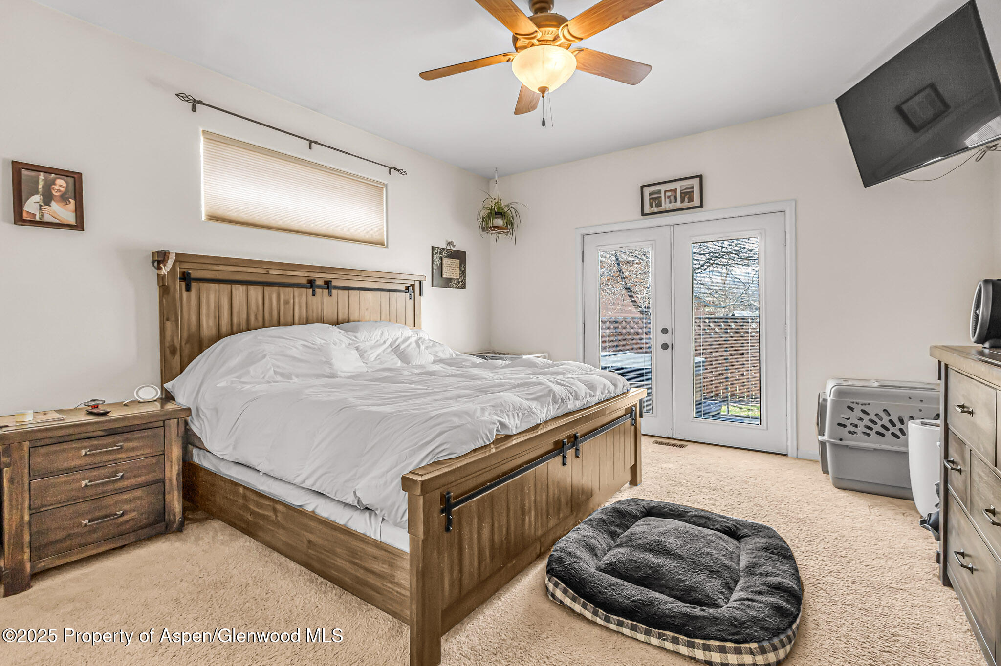 1357 West Spruce Court Rifle, CO 81650 - Photo 15 of 38 a bedroom with a bed and a television