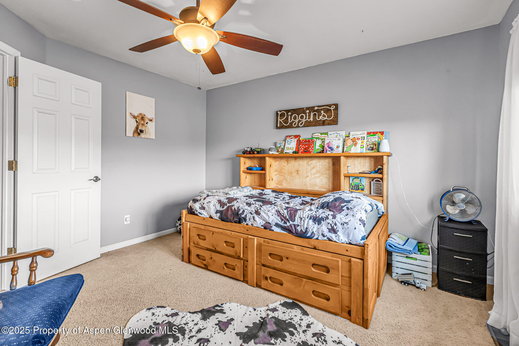 1357 West Spruce Court Rifle, CO 81650 - Photo 20 of 38 a bedroom with a bed and a dresser in it