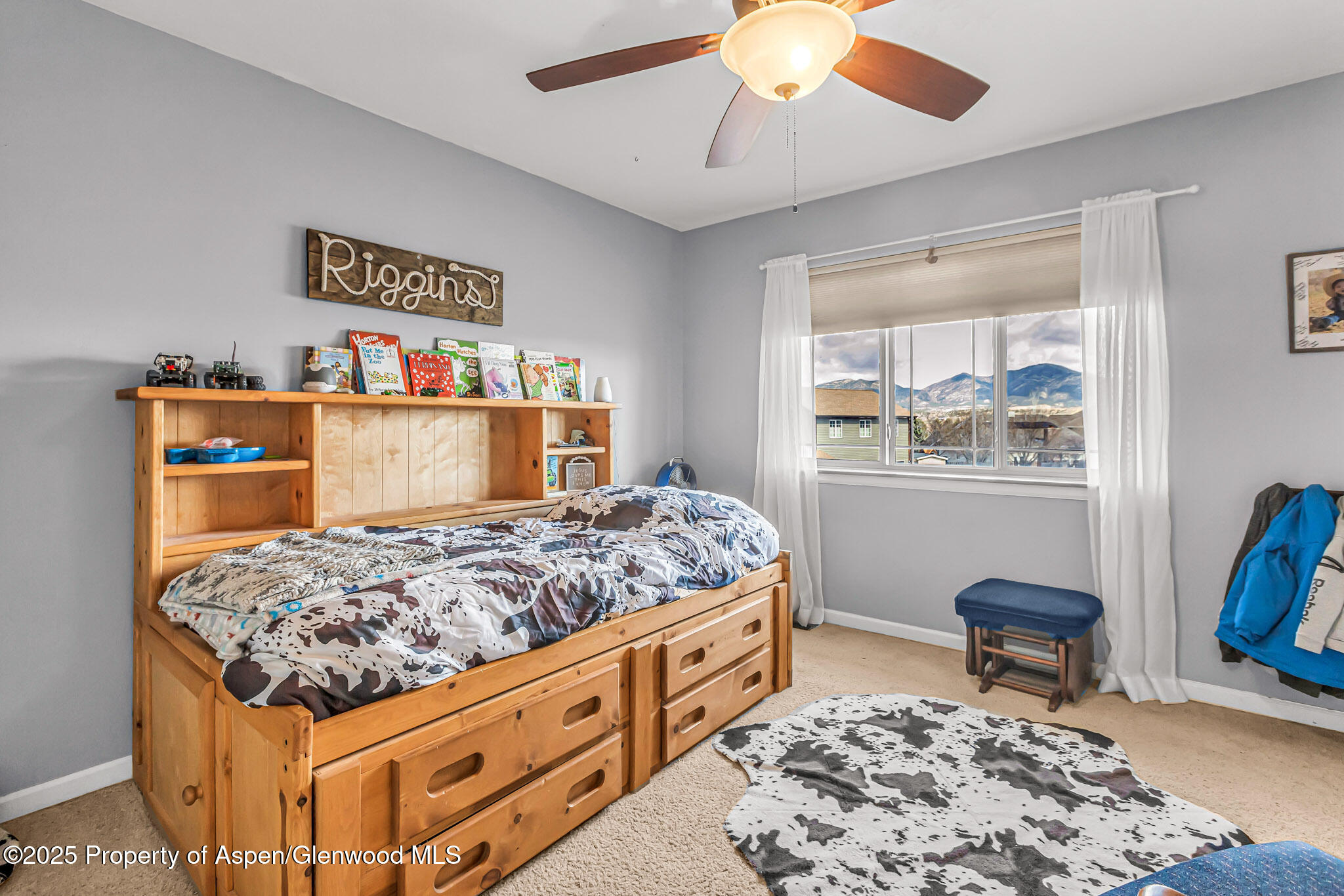1357 West Spruce Court Rifle, CO 81650 - Photo 21 of 38 a bedroom with a bed and wooden floor