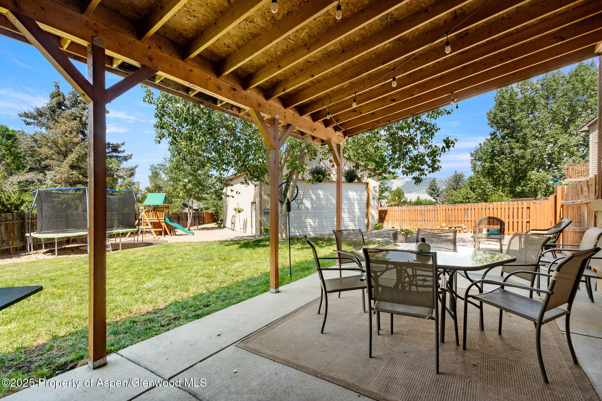 1357 West Spruce Court Rifle, CO 81650 - Photo 28 of 38 a patio with a yard table and chairs