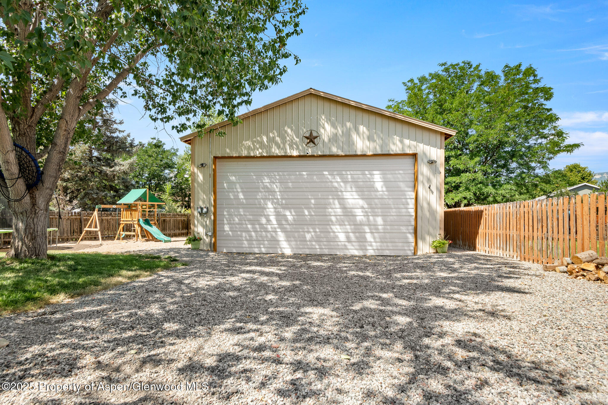 1357 West Spruce Court Rifle, CO 81650 - Photo 31 of 38 a front view of a house with a yard and garage