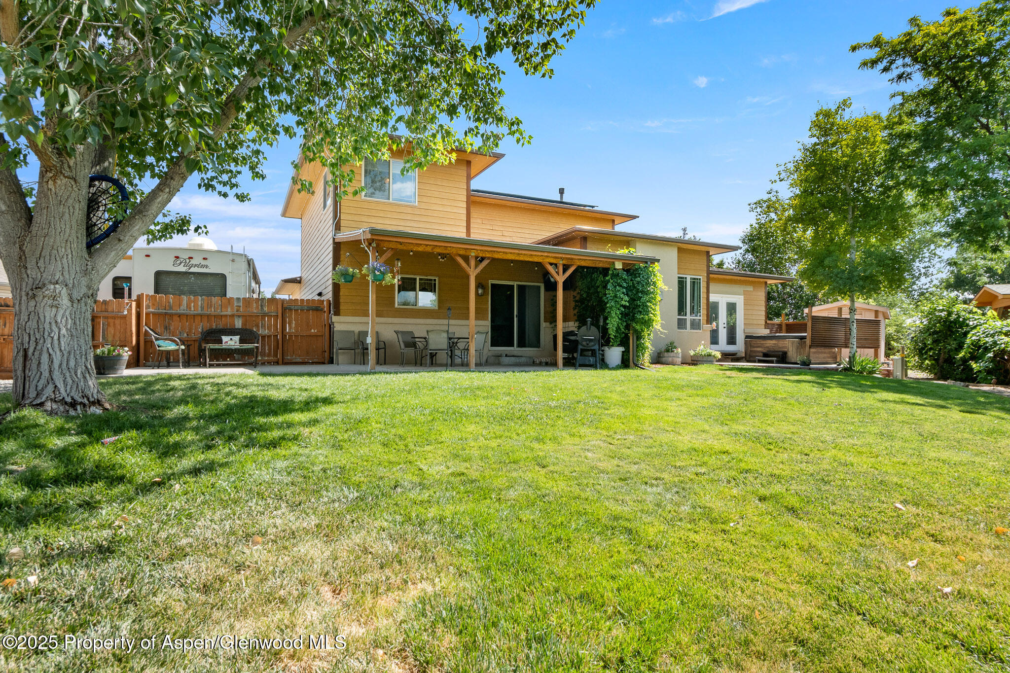 1357 West Spruce Court Rifle, CO 81650 - Photo 35 of 38 a front view of a house with a yard
