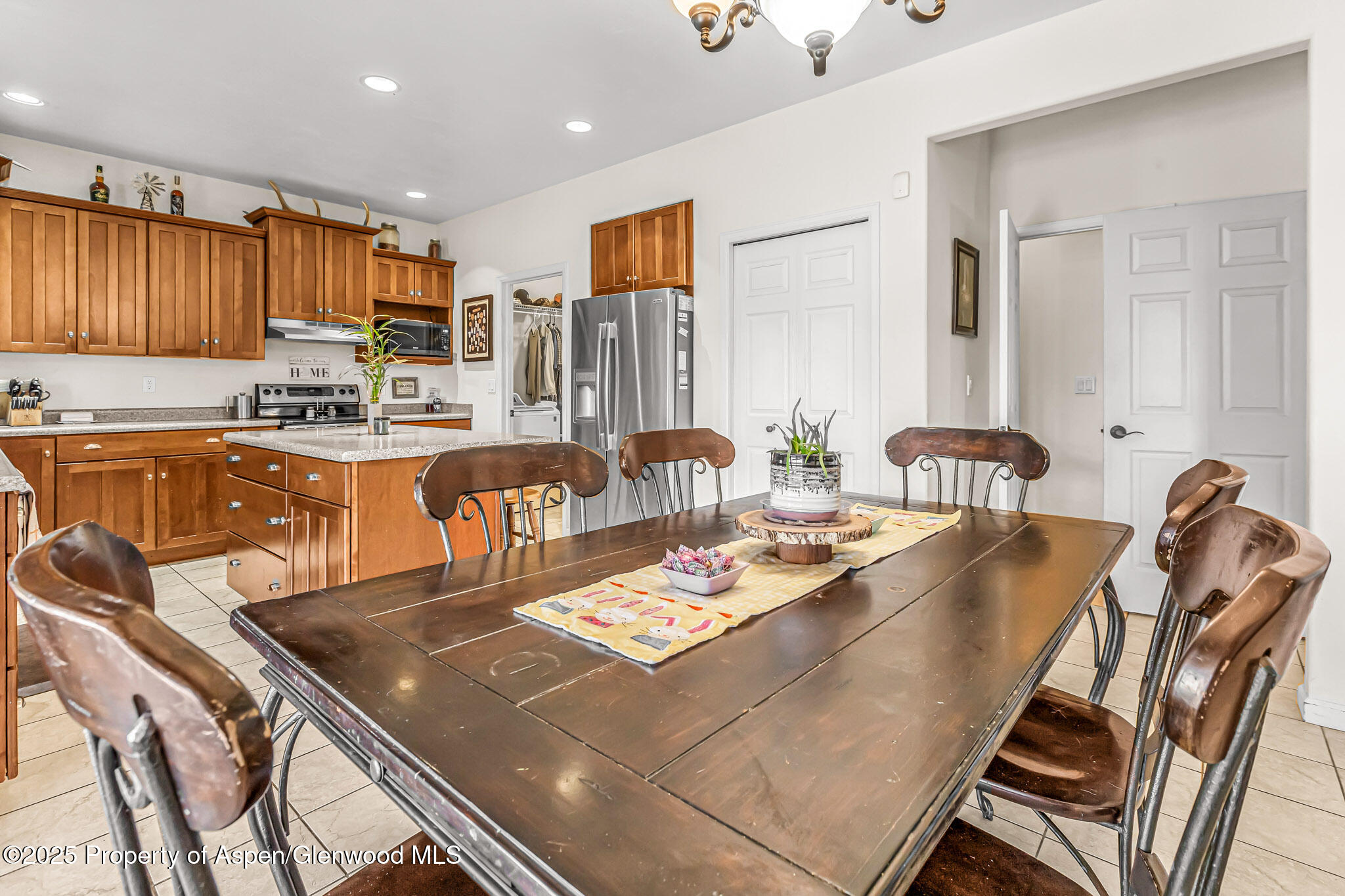 1357 West Spruce Court Rifle, CO 81650 - Photo 8 of 38 a large kitchen with a table and chairs