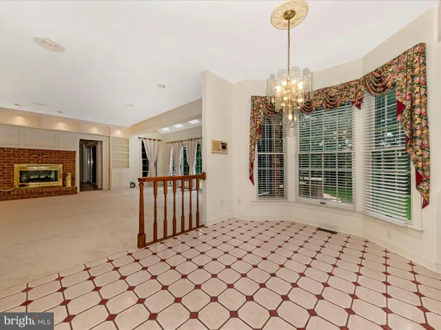 a kitchen with stainless steel appliances granite countertop a stove a sink dishwasher and cabinets with wooden floor