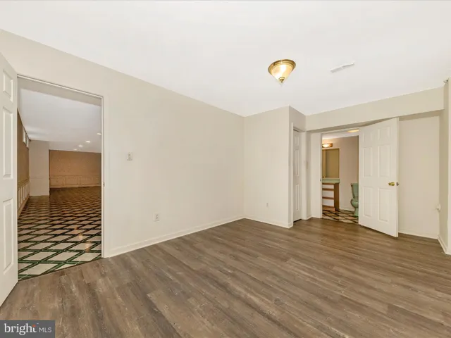 a view of a brick house with many windows
